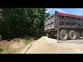 Mack Tri-Axle Dump Truck Unloading Full Truck Of Dirt