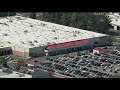 Costco shoppers wait in long lines wrapped around parking lot for a chance to get food