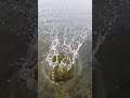 Slowmotion Rock hits water