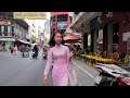 Traditional Ao Dai girl walking at Bui Vien Street early of Lunar New Year (2020)